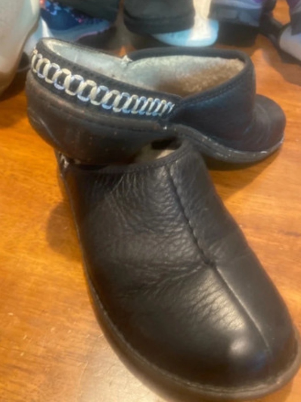 Black womens Slip-On Clogs with Decorative Stitching